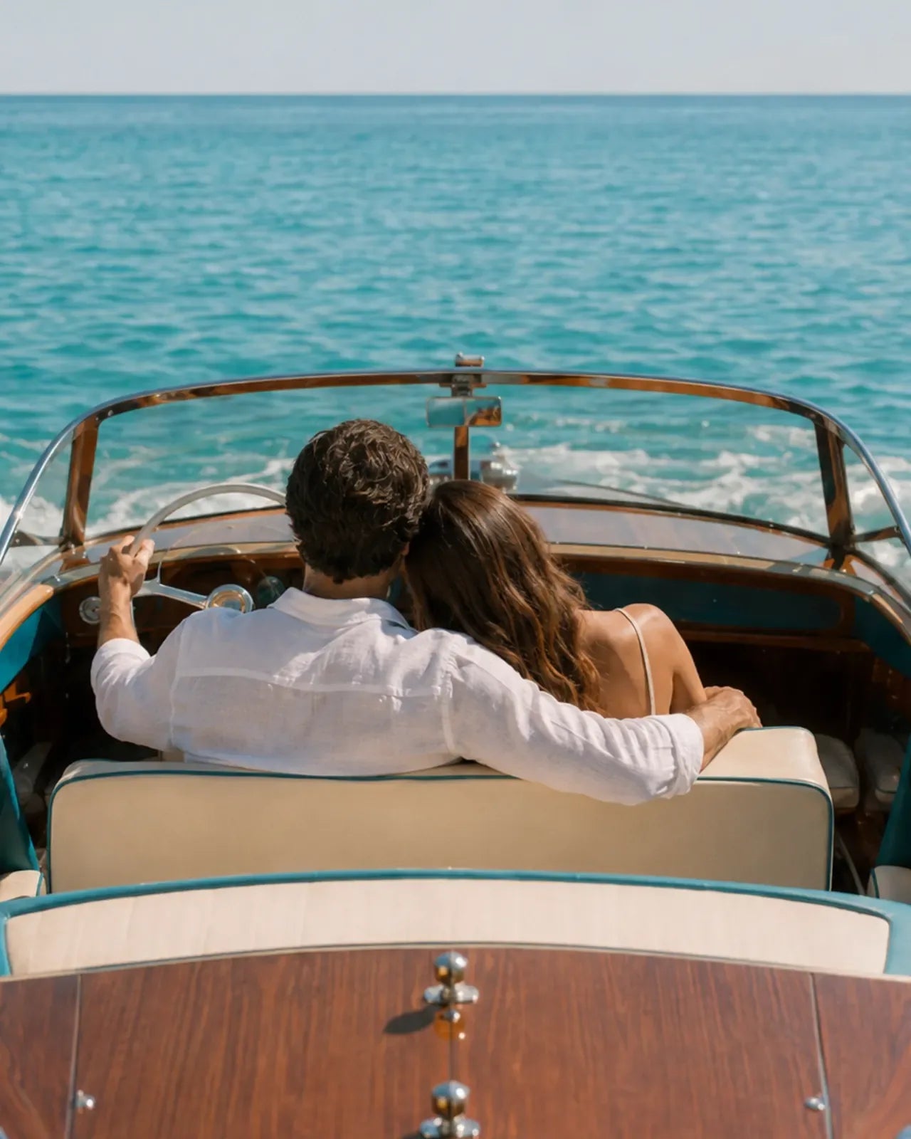 Couple riding in a wooden boat